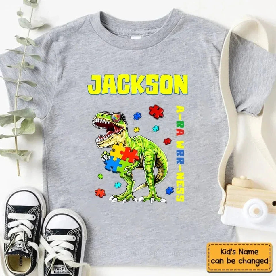 Puzzles and Dinosaurs - Personalized Name Colourful Graphic T-Shirt - A Gift for Child - Joliny