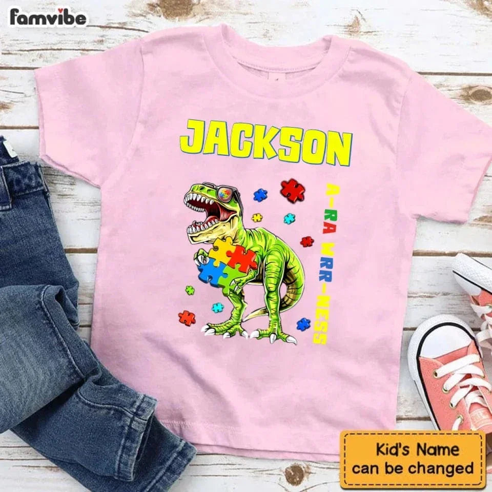 Puzzles and Dinosaurs - Personalized Name Colourful Graphic T-Shirt - A Gift for Child - Joliny