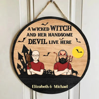 A Wicked Witch And Her Handsome Devil Live Here - Couple Personalized Custom Round Shaped Home Decor Witch Wood Sign - Halloween Gift For Witches, Husband Wife - Joliny